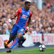 Crystal Palace's Ivorian-born English striker Wilfried Zaha running with the ball during the English Premier League football match between Tottenham Hotspur and Crystal Palace at White Hart Lane in London on August 20, 2016