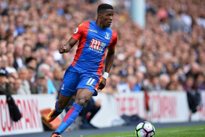 Crystal Palace's Ivorian-born English striker Wilfried Zaha running with the ball during the English Premier League football match between Tottenham Hotspur and Crystal Palace at White Hart Lane in London on August 20, 2016