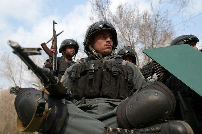 Afghan policemen arrive at the site of a terror attack in Kabul, on March 8, 2017
