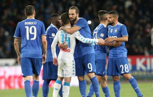 Juventus' forward Gonzalo Higuain greets Napoli's forward Dries Mertens at the end of an Italian Serie A football match on April 2, 2017 at the San Paolo Stadium