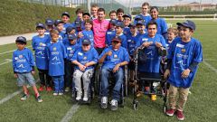 File image of Lionel Messi meeting a group of children. His charity works targets children