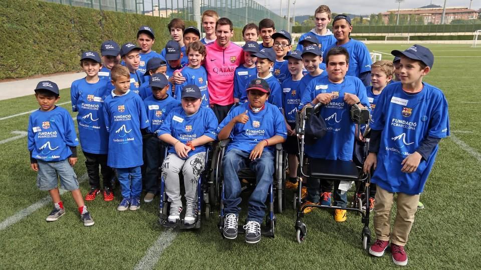 File image of Lionel Messi meeting a group of children. His charity works targets children