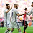 Real Madrid's forward Karim Benzema (C) is congratulated by teammates Cristiano Ronaldo (R) and defender Nacho Fernandez after scoring on March 18, 2017