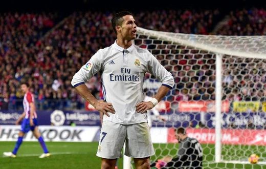 Real Madrid's forward Cristiano Ronaldo celebrates after scoring his third goal on November 19, 2016