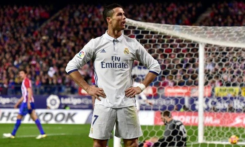 Real Madrid's forward Cristiano Ronaldo celebrates after scoring his third goal on November 19, 2016