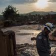 A firefighter walks in the mud in Bento Rodrigues, three days after an avalanche of mud and mining sludge buried the town in southeastern Brazil, on November 8, 2015