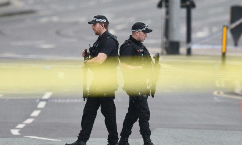 Armed police patrol near Manchester Arena on May 23, 2017 following a deadly terror attack in the city in northwest England