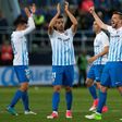 Malaga's players celebrates after winning 2-0 the Spanish league football match Malaga CF vs FC Barcelona at La Rosaleda stadium in Malaga on April 8, 2017