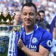 Chelsea's defender John Terry poses with the English Premier League trophy at Stamford Bridge in London on May 21, 2017