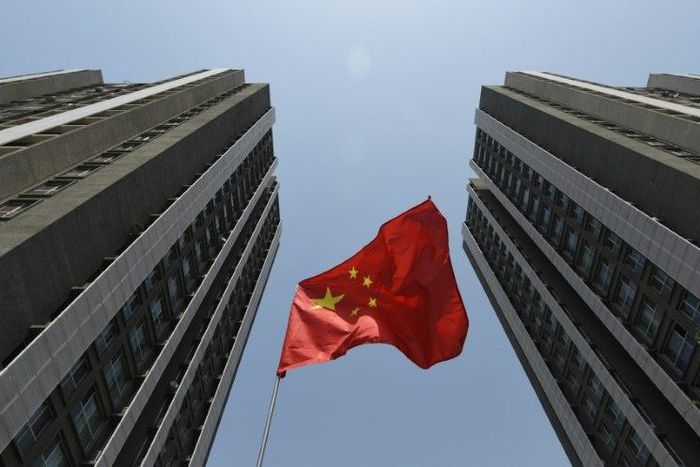 Moody's ratings agency downgrades China's credit score, warning that economy-wide debt is expected to rise as potential economic growth slows over the coming years