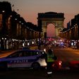 Police officers block the Champs Elysees boulevard in Paris after a shooting that left one police officer dead and another wounded on April 20, 2017