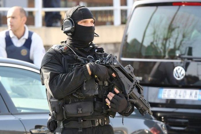 A member of the French RAID police unit on duty near the scene of a shooting at a school in the southern town of Grasse on March 16, 2017