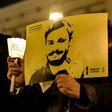 Activists of human rights organization Amnesty International hold a picture of Giulio Regeni and candles as they take part in a demonstration in front of Montecitorio, the Italian Parliament, in Rome on January 25, 2017