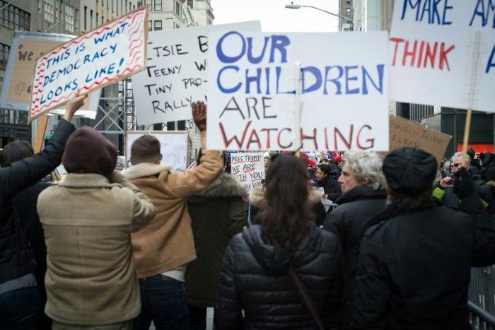Anti-Trump protesters shout at supporters of US President Donald Trump during a rally near Trump Tower in Fifth Avenue, February 5, 2017 in New York