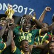 Cameroon's players celebrate with the winner's trophy after defeating Egypt 2-1 to win the 2017 Africa Cup of Nations, at the Stade de l'Amitie Sino-Gabonaise in Libreville, on February 5