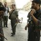 Members of the Kurdish police and the Kurdish People's Protection Units(YPG) patrol in the northeastern Syrian city of Hasakeh