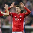 Bayern Munich's Robert Lewandowski (R) celebrates with teammate Arjen Robben during their German Cup quarter-final football match against Schalke in Munich, on March 1, 2017