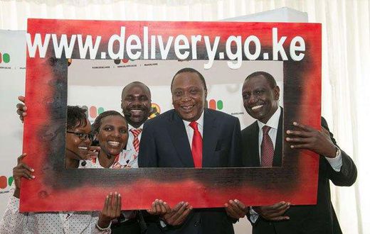 President Uhuru Kenyatta and Deputy President William Ruto pose with government officers at the launch of the National Government Public Information Portal at KICC in Nairobi on April 10, 2017.