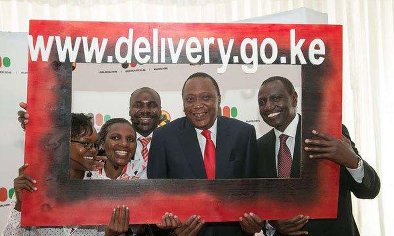 President Uhuru Kenyatta and Deputy President William Ruto pose with government officers at the launch of the National Government Public Information Portal at KICC in Nairobi on April 10, 2017.