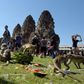 Macaques eat fruit at an ancient temple during the annual "monkey buffet" in Thailand's Lopburi province, north of Bangkok on November 27, 2016
