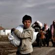 Residents of west Mosul flee the city on March 14, 2017, among more than 150,000 that have been displaced by the offensive government forces launched against the Islamic State group last month
