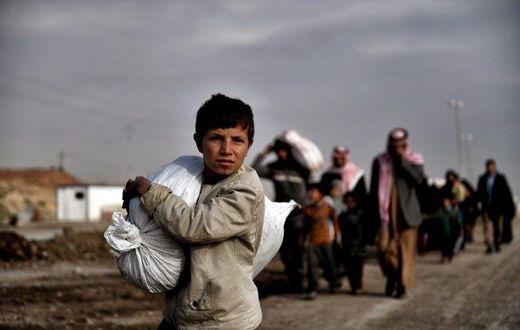 Residents of west Mosul flee the city on March 14, 2017, among more than 150,000 that have been displaced by the offensive government forces launched against the Islamic State group last month