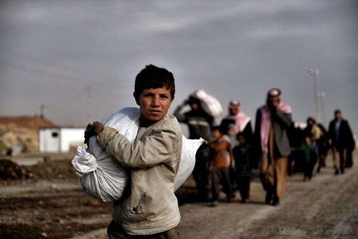 Residents of west Mosul flee the city on March 14, 2017, among more than 150,000 that have been displaced by the offensive government forces launched against the Islamic State group last month