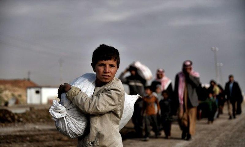 Residents of west Mosul flee the city on March 14, 2017, among more than 150,000 that have been displaced by the offensive government forces launched against the Islamic State group last month