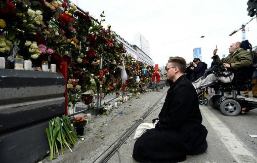 Shocked Swedes remember victims of Friday's lorry attack on a crowded Stockholm street