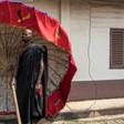 A man carrying a tradionnal umbrella in Kumasi on November 24 at a ceremony following the death of Nana Afia Kobi Serwaa Ampem II