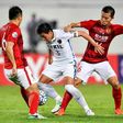 Shoji Gen (centre) of Japan's Kashima Antlers fights for the ball with Huang Bowen of China's Guangzhou Evergrande during their AFC Champions League match in Guangzhou, in China's Guangdong province on May 23, 2017