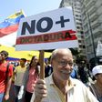 Venezuelan opposition activists shout slogans during a protest against the government of President Nicolas Maduro on April 6, 2017 in Caracas
