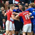 Middlesbrough and Manchester United players clash towards the end of their English Premier League match, at Riverside Stadium in Middlesbrough, on March 19, 2017