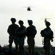American soldiers wait to board helicopters at Kandahar airbase in Afghanistan in 2003