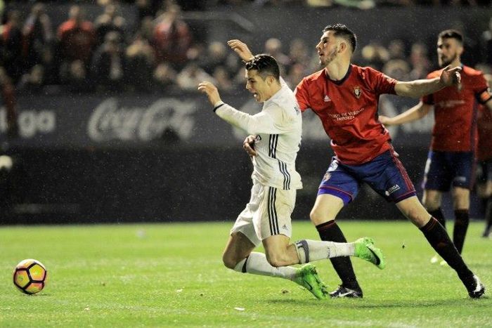 Cristiano Ronaldo (left) suffered a heavy tackle against Osasuna at the weekend