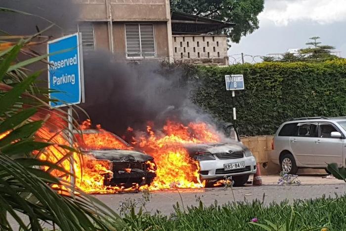Vehicles burning at the Dusit complex