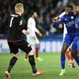 Leicester City's midfielder Wilfred Ndidi (C), defender Wes Morgan (R) and goalkeeper Kasper Schmeichel (L) celebrate their victory at the final whistle during the UEFA Champions League football match against Sevilla March 14, 2017