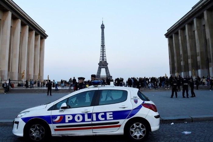 Candidates in the French presidential election have clashed over how to protect France since a policeman was shot dead in Paris
