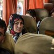 Syrian victims of a suspected chemical attack are carried in a bus back to the Syrian border after treatment in Turkey on April 7, 2017
