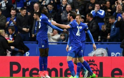 Leicester City's Wilfred Ndidi (L) celebrates scoring their opening goal against Stoke City at King Power Stadium in Leicester, central England on April 1, 2017
