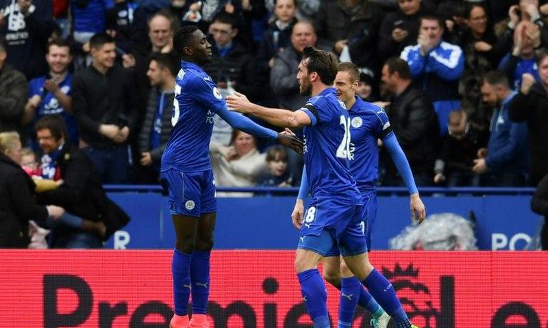 Leicester City's Wilfred Ndidi (L) celebrates scoring their opening goal against Stoke City at King Power Stadium in Leicester, central England on April 1, 2017