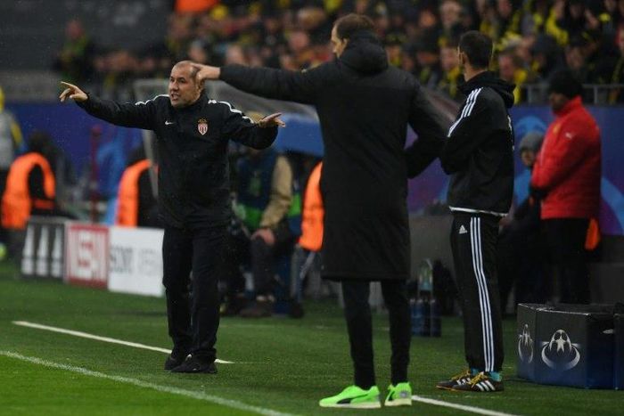 Monaco's head coach Leonardo Jardim (L) and Dortmund's Thomas Tuchel react on the sideline during their UEFA Champions League quarter-final 1st leg match, in Dortmund, on April 12, 2017