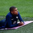 France's forward Kylian Mbappe (R) rests during a training session at the Roazhon Park stadium in Rennes, on June 1, 2017
