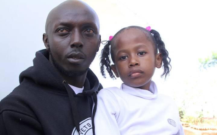 Peter Kimani with his daughter Gloria Wangari who were waiting for Florence Wangari at JKIA. She perished in the ET 302 plane crash (The Standard)