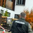 A policeman on October 19, 2016 in Georgensgmuend, southern Germany, in front of a house of a member of the so-called Reichsbuerger movement