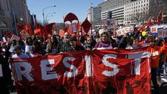 Health care activists march to the Trump International hotel in Washington, DC, during a protest against President Donald Trump's effort to repeal Obamacare