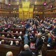 The House of Lords defied Prime Minister Theresa May by demanding guarantees for EU nationals living in Britain, delaying a bill she needs to start Brexit negotiations