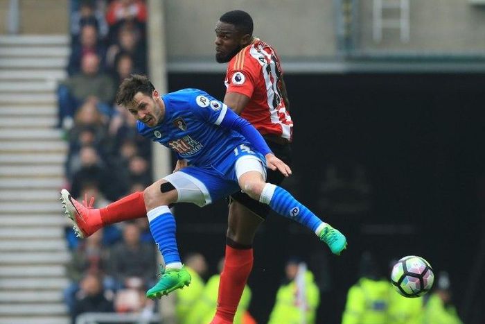 Sunderland's Victor Anichebe (R) challenges Bournemouth's English defender Adam Smith (L) during their Premier league match at the Stadium of Light in Sunderland, north-east England on April 29, 2017