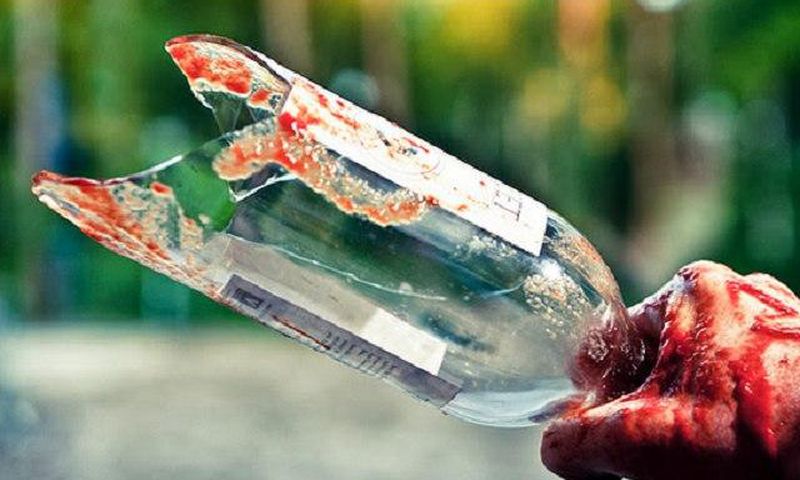 A broken bottle used as weapon of attack