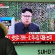 A man watches the news showing file footage of North Korean leader Kim Jong-Un at a railway station in Seoul on February 12, 2017